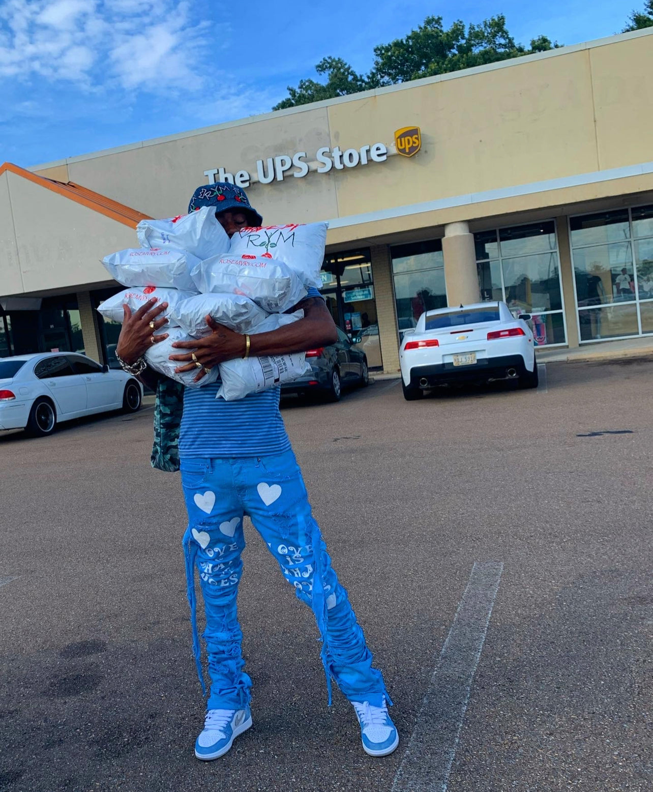 LOVE IS WHAT LOVE DOES BLUE XAGGERATED DENIM